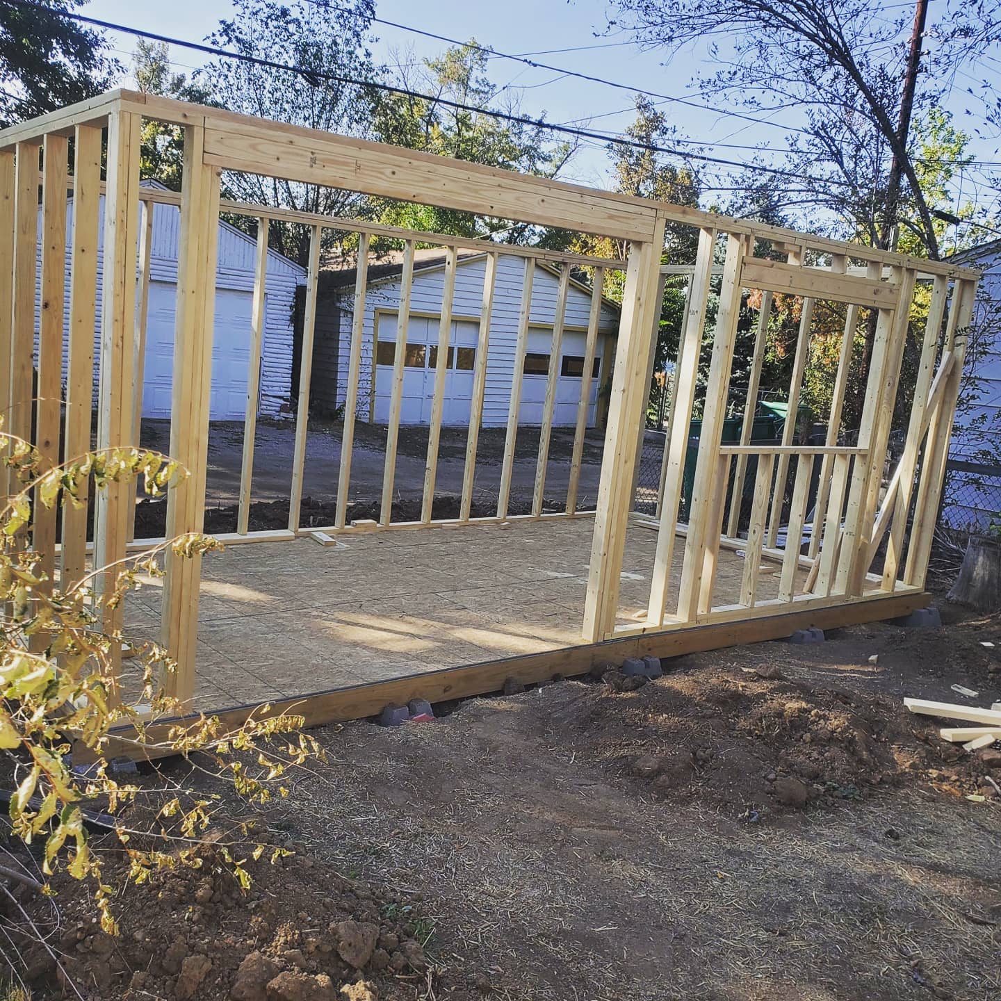 A photograph of my shed project at the point of framed walls being erected, but not sheathed.